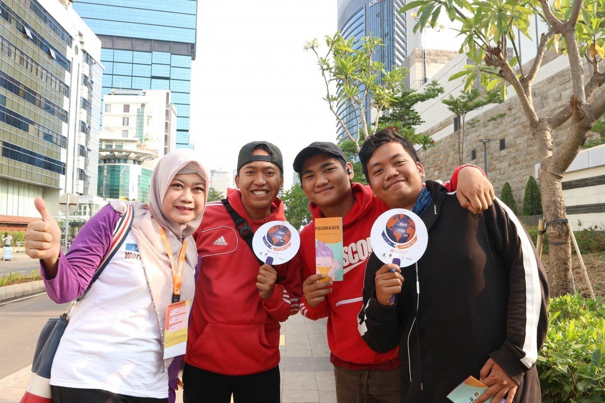 Dermato-venereologists in action: giving education about psoriasis through brochures, flyers, and hand fans as media around Jendral Sudirman Street